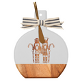 The Maple Acacia Bevel Board White (9.75 x 8") features gilded nutcracker designs, a striped ribbon on the handle, and comes with a gold spreader knife—ideal for stylish charcuterie spreads.