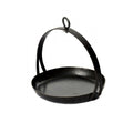 Cast iron tripod skillet hanging from adjustable tripod over garden firepit for outdoor cooking