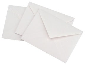 Three plain white envelopes are stacked and slightly overlapping on a white background, perfect for sending your nature-inspired art or sun prints made with the Outdoor Discovery Solar Print Kit by Outdoor Discovery.