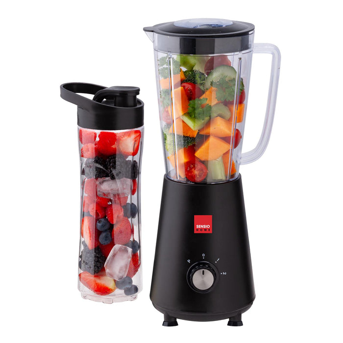 A personal blender with a large 1L jar filled with fruits and vegetables, alongside a portable 600ml sports bottle, both are BPA-free and black in color. - Buy Now Personal Blender Smoothie Maker