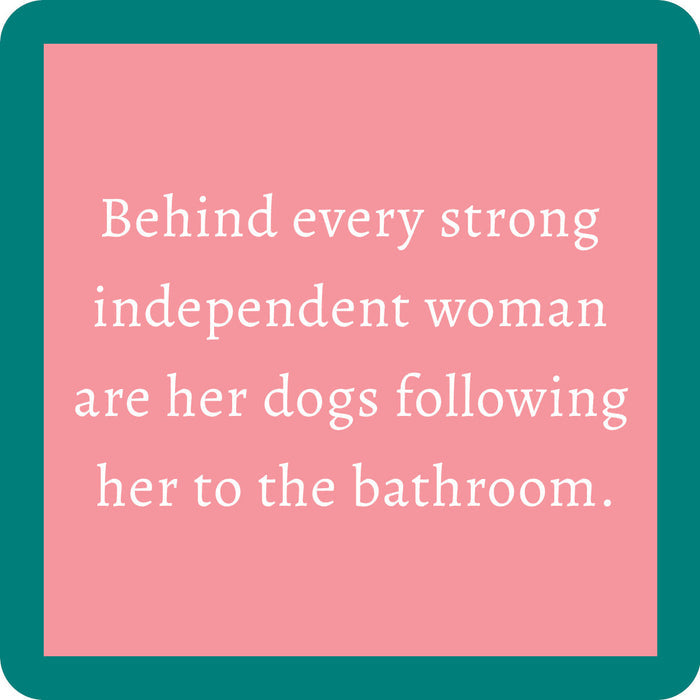 The Powerful Woman Coaster by Drinks On Me features a pink square with a teal border and the text: "Behind every strong independent woman are her dogs following her to the bathroom." A funny gift for dog lovers!.