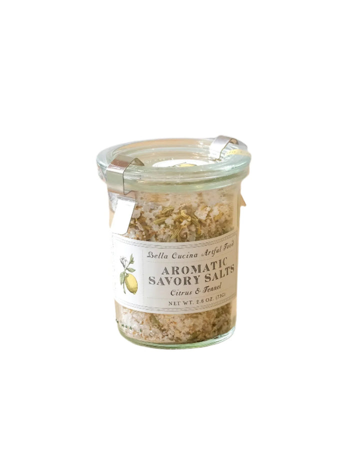 The Bella Cucina Savory Salt Duo Gift Set features aromatic salts in glass jars with metal clasps and decorative labels, perfect for gourmet charcuterie boards. Each set includes 6 oz (170g) of seasoning.