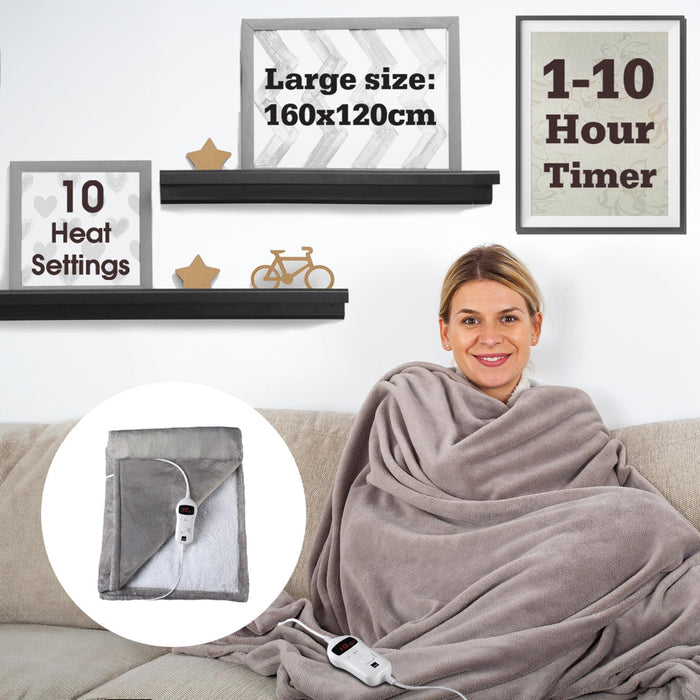 A person wrapped in a grey electric blanket sitting on a sofa with a remote control beside them. - Buy Now Luxury Heated Throw Electric Blanket Grey