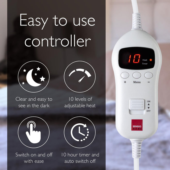 White electronic controller with digital display and text highlighting features, set against a blurred background.- Buy Now Cream Luxury Heated Throw + Foot Warmer