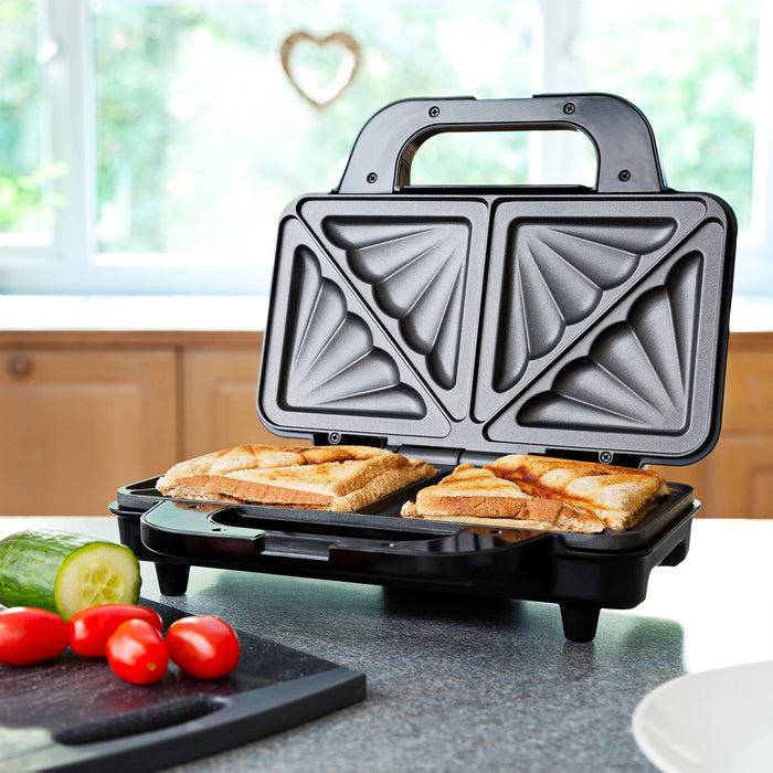 Triangular sandwich maker with bread slices on a kitchen counter - Buy Now Deep Fill Sandwich Toaster + Round Waffle Maker
