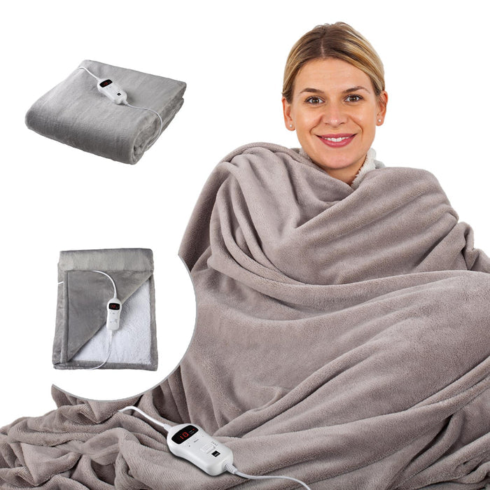 Woman wrapped in a gray electric blanket with controllers on a white background - Buy Now Grey Luxury Heated Throw + Foot Warmer