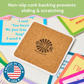 A square cork Bible Coaster by Drinks On Me features a "Made in the USA" badge and is surrounded by colorful, humorous coasters—perfect for your bar cart accessories.